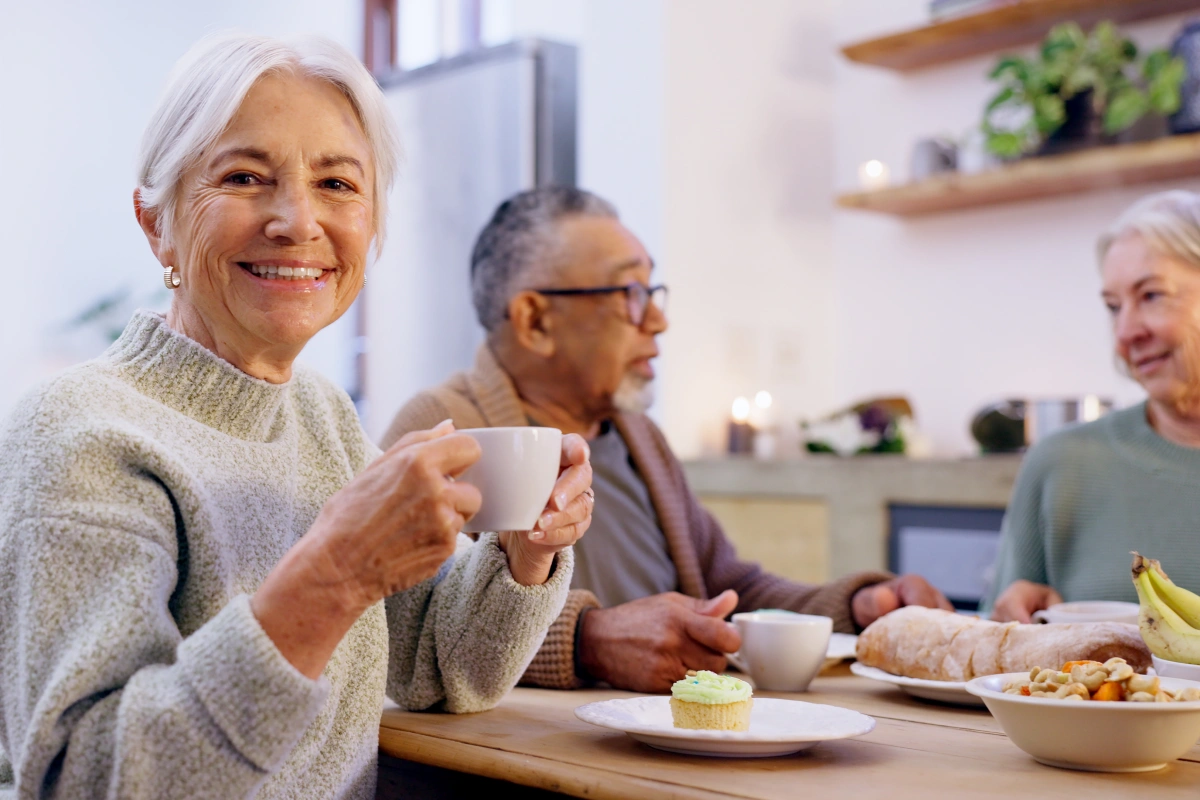 Senior woman enjoying breakfast and community
